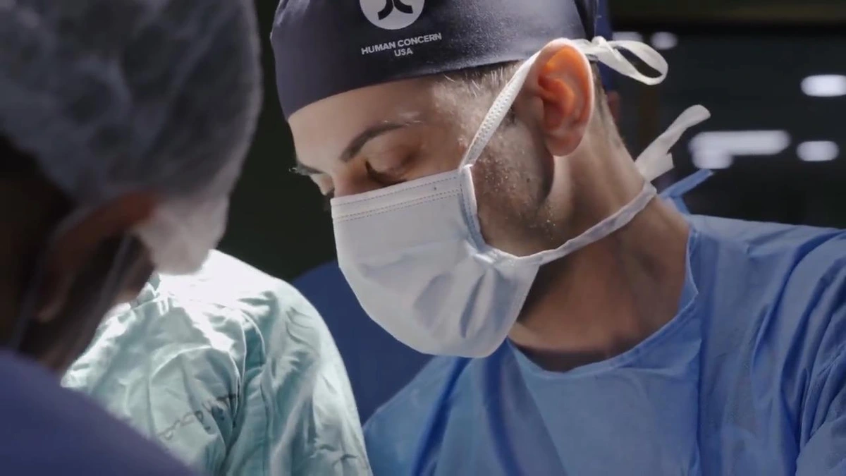 Screenshot from American Doctor trailer, showing a doctor in operating room in Gaza