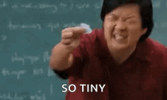 Professor Chang from Community squinting at a small piece of paper and saying "So tiny"