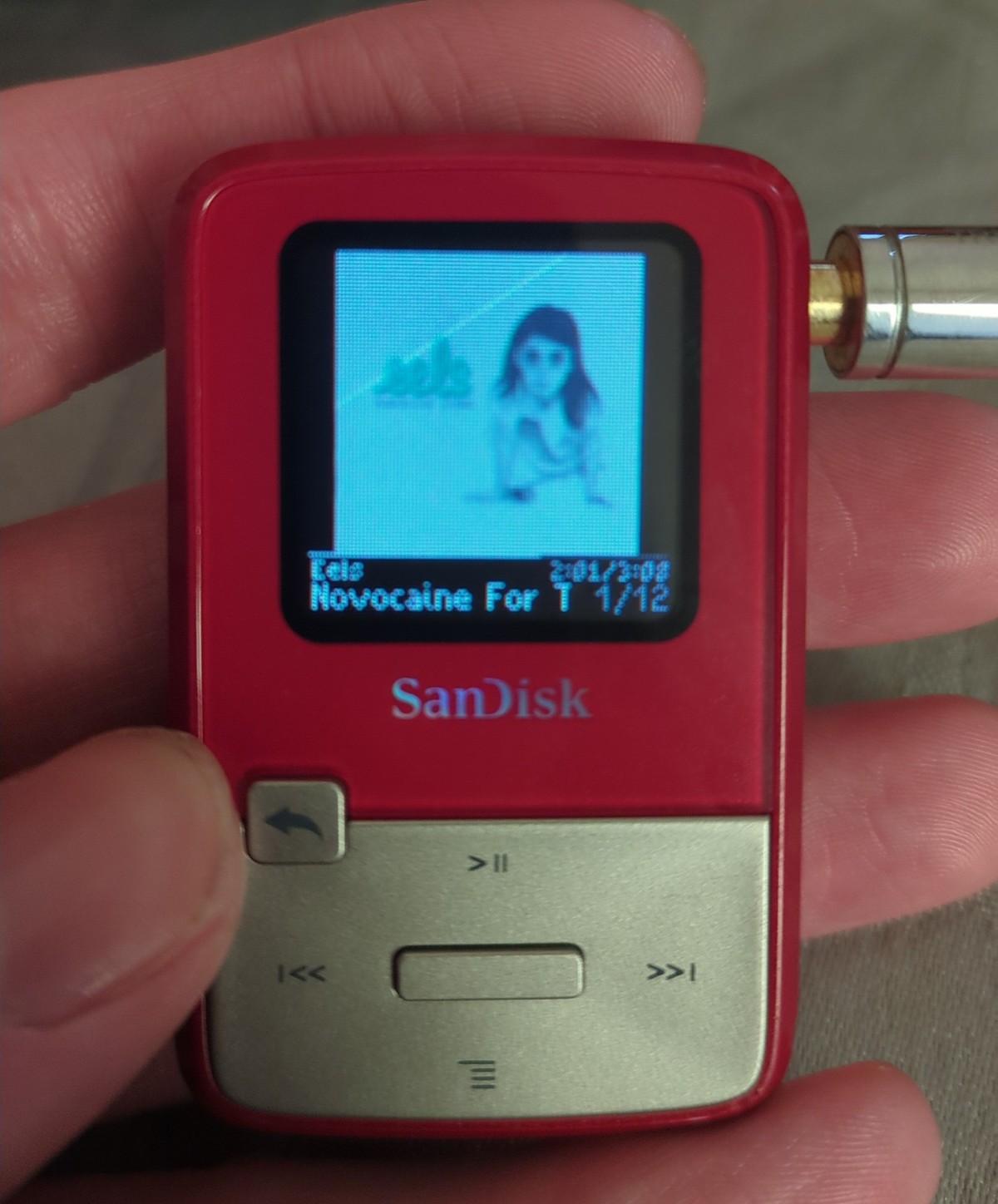 SanDisk's Sansa Clip Zip in Red & White playing 'Novocaine For Soul' by Eels.