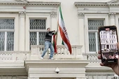 Dramatic scenes as man climbs Iran embassy balcony and tears down flag