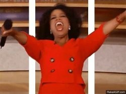 Oprah proclaiming to the crowd